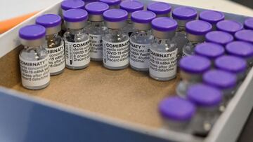 A photograph taken on April 15, 2021 shows vials of the Pfizer/BioNTech vaccine against Covid-19 during a vaccination campaign at the city hall of Montpellier, southern France, aimed at stemming the spread of the Covid-19 pandemic. (Photo by Pascal GUYOT / AFP)