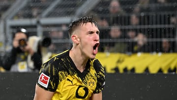 Dortmund's German defender #04 Nico Schlotterbeck celebrates after scoring the 2-0 goal during the German first division Bundesliga football match between BVB Borussia Dortmund and TSG 1899 Hoffenheim in Dortmund, western Germany, on December 7, 2025. (Photo by UWE KRAFT / AFP) / DFL REGULATIONS PROHIBIT ANY USE OF PHOTOGRAPHS AS IMAGE SEQUENCES AND/OR QUASI-VIDEO