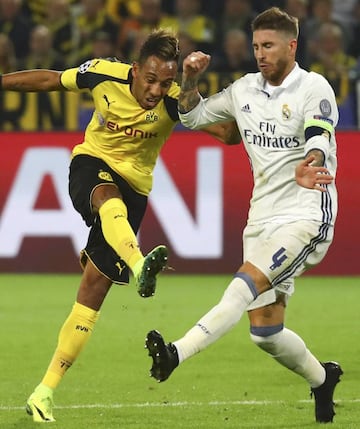 Dortmund's Pierre - Emerick Aubameyang and Real Madrid's Karim Benzema in action.