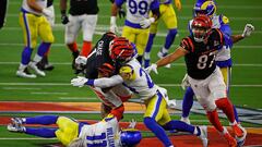 INGLEWOOD, CALIFORNIA - FEBRUARY 13: Ja&#039;Marr Chase #1 of the Cincinnati Bengals is tackled by Taylor Rapp #24 and Darious Williams #11 of the Los Angeles Rams in the third quarter during Super Bowl LVI at SoFi Stadium on February 13, 2022 in Inglewoo