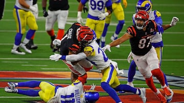 INGLEWOOD, CALIFORNIA - FEBRUARY 13: Ja&#039;Marr Chase #1 of the Cincinnati Bengals is tackled by Taylor Rapp #24 and Darious Williams #11 of the Los Angeles Rams in the third quarter during Super Bowl LVI at SoFi Stadium on February 13, 2022 in Inglewoo