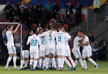 Real Madrid players celebrate Cristiano Ronaldo's winning goal.