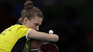 Natalia Partyka of Poland serves as she competes with her teammate Katarzyna Grzybowska-Franc against Mima Ito and Ai Fukuhara of Japan during their women&#039;s team table tennis first round match at the 2016 Summer Olympics in Rio de Janeiro, Brazil, Friday, Aug. 12, 2016. (AP Photo/Petros Giannakouris)