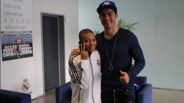Mbappé (left) meets Cristiano Ronaldo in December 2012.