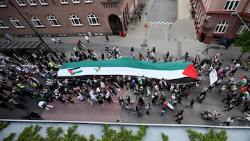Protesters hold a huge Palestinian flag during the "Stop Israel" demonstration, against Israel's participation in the Eurovision Song Contest due to its ongoing offensive in Gaza against Hamas, in Malmo, Sweden, May 11, 2024. TT News Agency/Johan Nilsson via REUTERS ATTENTION EDITORS - THIS IMAGE WAS PROVIDED BY A THIRD PARTY. SWEDEN OUT. NO COMMERCIAL OR EDITORIAL SALES IN SWEDEN.