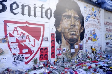 Fans place offerings to late Diego Maradona in front of mural outside Argentinos Juniors' Stadium Diego Maradona in Buenos Aires, Argentina.