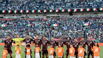 DENVER, COLORADO - JUNE 05: Team Mexico stands for their national anthem before their match against Uruguay during an international friendly match between Mexico and Uruguay at Empower Field At Mile High on June 05, 2024 in Denver, Colorado. Matthew Stockman/Getty Images/AFP (Photo by MATTHEW STOCKMAN / GETTY IMAGES NORTH AMERICA / Getty Images via AFP)