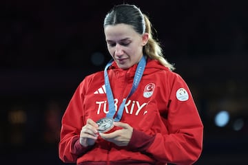 Hatice Akbas of Turkey looks at her Olympic silver medal.