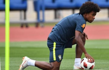 Brazil's forward Willian stretches during a training session at Yug Sport Stadium, in Sochi, on July 4, 2018, during the Russia 2018 World Cup football tournament