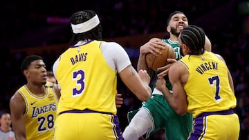 Jayson Tatum #0 of the Boston Celtics reacts as he is fouled by Gabe Vincent #7 of the Los Angeles Lakers in front of Anthony Davis #3 and Rui Hachimura #28 during the first half at Crypto.com Arena on January 23, 2025 in Los Angeles, California.