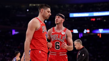 NEW YORK, NEW YORK - APRIL 14: Nikola Vucevic #9 and Alex Caruso #6 of the Chicago Bulls talk as they head into a time out during the first half against the New York Knicks at Madison Square Garden on April 14, 2024 in New York City.