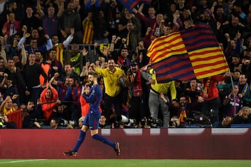 Piqué celebrates after scoring.