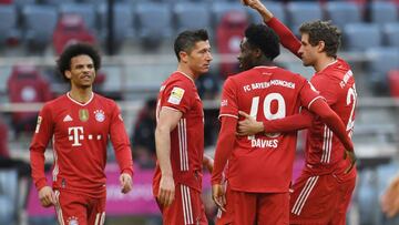 Soccer Football - Bundesliga - Bayern Munich v FC Cologne - Allianz Arena, Munich, Germany - February 27, 2021 Bayern Munich's Robert Lewandowski celebrates scoring their third goal with teammates REUTERS/Andreas Gebert DFL regulations prohibit any u