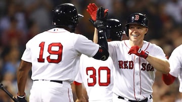 BOSTON, MA - SEPTEMBER 11: Brock Holt #12 of the Boston Red Sox celebrates with Jackie Bradley Jr. #19 after hitting a three run home run against the Toronto Blue Jays during the seventh inning at Fenway Park on September 11, 2018 in Boston, Massachusetts.  Maddie Meyer/Getty Images/AFP
 == FOR NEWSPAPERS, INTERNET, TELCOS &amp; TELEVISION USE ONLY ==