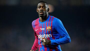 (FILES) In this file photo taken on December 18, 2021 Barcelona's French forward Ousmane Dembele runs on the pitch during the Spanish league football match between FC Barcelona and Elche CF at the Camp Nou stadium in Barcelona. - Barcelona's spo