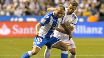 El defensa del Real Madrid Nacho (d) lucha el bal&oacute;n con el delantero rumano Florin Andone, del Deportivo de La Coru&ntilde;a, durante el partido de la primera jornada de Liga en Primera Division que se juega esta noche en el estadio de Riazor, en A Coru&ntilde;a. 