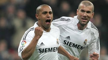 Roberto Carlos, pictured here with Zinedine Zidane, joined Real Madrid in 1996.