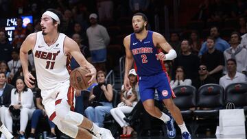 MIAMI, FLORIDA - OCTOBER 28: Jaime Jaquez Jr. #11 of the Miami Heat controls the ball ahead of Cade Cunningham #2 of the Detroit Pistons during the second half at Kaseya Center on October 28, 2024 in Miami, Florida. NOTE TO USER: User expressly acknowledges and agrees that, by downloading and or using this photograph, User is consenting to the terms and conditions of the Getty Images License Agreement. Carmen Mandato/Getty Images/AFP (Photo by Carmen Mandato / GETTY IMAGES NORTH AMERICA / Getty Images via AFP)