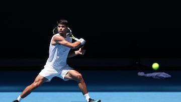 Spain�s Carlos Alcaraz hits a shot during a practice session on John Cain Arena in Melbourne on January 11, 2024 ahead of the Australian Open tennis championship starting on January 14. (Photo by DAVID GRAY / AFP) / -- IMAGE RESTRICTED TO EDITORIAL USE - STRICTLY NO COMMERCIAL USE --