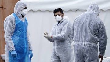 Specially trained volunteers work at a temporary mortuary erected in the car park of Central Jamia Mosque Ghamkol Sharif on April 18, 2020 in Birmingham, England.