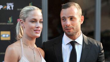 (FILES) This picture taken on November 4, 2012 during the Feather Awards held at Melrose Arch in Johannesburg shows South Africa's Olympic sprint star Oscar Pistorius and his model girlfriend Reeva Steenkamp. The mother of Reeva Steenkamp, a South African model killed by ex-Olympian Oscar Pistorius, is the one "serving a life sentence", she said in a statement on January 5, 2024 ahead of his release from prison. (Photo by LUCKY NXUMALO / AFP)