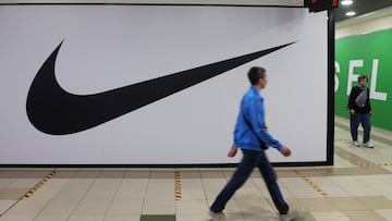 FILE PHOTO: People walk past a closed store of the sporting goods retailer Nike at a shopping mall in Saint Petersburg, Russia May 25, 2022. REUTERS/Anton Vaganov/File Photo