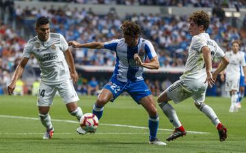 Estéban Granero entre Casemiro y Álvaro Odriozola.


