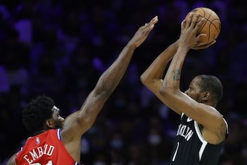 PHILADELPHIA, PENNSYLVANIA - OCTOBER 22: Kevin Durant #7 of the Brooklyn Nets shoots over Joel Embiid #21 of the Philadelphia 76ers during the third quarter at Wells Fargo Center on October 22, 2021 in Philadelphia, Pennsylvania.