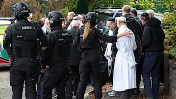 People gather near the scene, after a report of an incident in which a car was driven at pedestrians and a stabbing attack, near a synagogue in north Manchester, Britain, October 2, 2025. REUTERS/Phil Noble