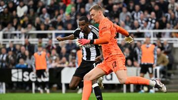 Newcastle United's Swedish striker #14 Alexander Isak vies for the ball with Chelsea's Swedish-Danish goalkeeper #12 Filip Jorgensen during the English League Cup round of 16 football match between Newcastle United and Chelsea at St James' Park in Newcastle-upon-Tyne, north east England on October 30, 2024. (Photo by ANDY BUCHANAN / AFP) / RESTRICTED TO EDITORIAL USE. No use with unauthorized audio, video, data, fixture lists, club/league logos or 'live' services. Online in-match use limited to 120 images. An additional 40 images may be used in extra time. No video emulation. Social media in-match use limited to 120 images. An additional 40 images may be used in extra time. No use in betting publications, games or single club/league/player publications. /
