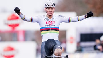 Dutch rider Mathieu Van Der Poel celebrates as he crosses the finish line to win the Men's UCI Cyclocross World Cup elite race in Gavere, northern Belgium, on December 26, 2024. (Photo by JASPER JACOBS / Belga / AFP) / Belgium OUT