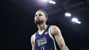 USA's #04 Stephen Curry reacts in the men's preliminary round group C basketball match between Serbia and USA during the Paris 2024 Olympic Games at the Pierre-Mauroy stadium in Villeneuve-d'Ascq, northern France, on July 28, 2024. (Photo by Sameer Al-Doumy / AFP)