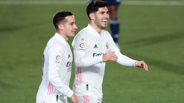 MADRID, SPAIN - JANUARY 02: Marco Asensio of Real Madrid celebrates with teammate Lucas Vazquez after scoring their team's second goal during the La Liga Santander match between Real Madrid and RC Celta at Estadio Santiago Bernabeu on January 02, 202