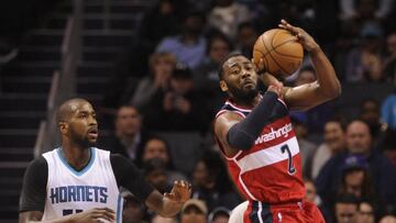 Jan 23, 2017; Charlotte, NC, USA; Washington Wizards guard John Wall (2) looks to pass as he is defended by Charlotte Hornets forward Michael Kidd-Gilchrist (14) during the second half of the game at the Spectrum Center. Wizards win 109-99. Mandatory Credit: Sam Sharpe-USA TODAY Sports