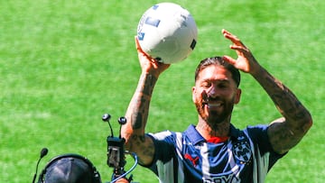Monterrey Rayados' new signing Spanish football player Sergio Ramos holds the ball during his presentation at the BBVA stadium in Guadalupe, Nuevo Leon state, Mexico on February 9, 2025. (Photo by Julio Cesar AGUILAR / AFP)