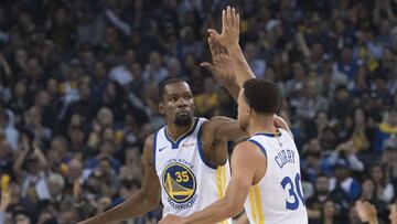 October 16, 2018; Oakland, CA, USA; Golden State Warriors forward Kevin Durant (35) congratulates guard Stephen Curry (30) for making a three-point basket against the Oklahoma City Thunder during the first quarter at Oracle Arena. Mandatory Credit: Kyle Terada-USA TODAY Sports
