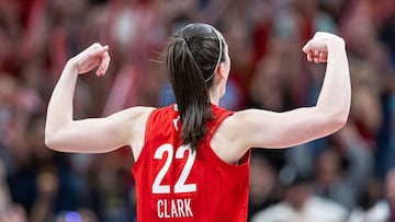 INDIANAPOLIS, INDIANA - JULY 6: Caitlin Clark #22 of the Indiana Fever reacts to the Indiana Fever bench during the second half against the New York Liberty at Gainbridge Fieldhouse on July 6, 2024 in Indianapolis, Indiana. NOTE TO USER: User expressly acknowledges and agrees that, by downloading and or using this photograph, User is consenting to the terms and conditions of the Getty Images License Agreement. Michael Hickey/Getty Images/AFP (Photo by Michael Hickey / GETTY IMAGES NORTH AMERICA / Getty Images via AFP)