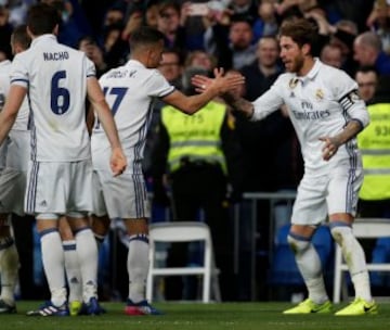 Football Soccer - Real Madrid v Real Betis - Spanish La Liga Santander - Santiago Bernabéu stadium, Madrid, Spain, 12/03/17 Real Madrid's Sergio Ramos (R) celebrates with team mate Lucas Vazquez after scoring a goal. REUTERS/Sergio Perez