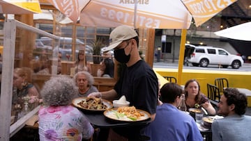 Food is served to guests at a restaurant in New York City after Mayor Bill de Blasio announced that proof of vaccination will be required to enter most places.