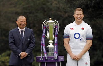 England's coach Eddie Jones (L) and captain Dylan Hartley pose with the trophy during the 6 Nations Launch event in west London on January 24, 2018.