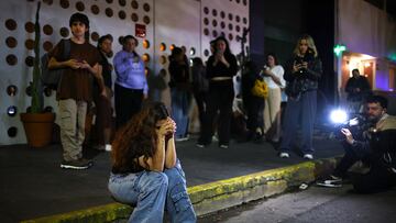 A fan reacts outside the hotel where Liam Payne, former One Direction member, was found dead, in Buenos Aires, Argentina, October 16, 2024. REUTERS/Agustin Marcarian