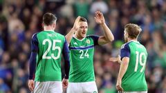 Northern Ireland&#039;s striker Conor Washington (C) celebrates with Northern Ireland&#039;s defender Michael Smith (L) and Northern Ireland&#039;s striker Jamie Ward (R) after scoring the opening goal of the international friendly football match between 