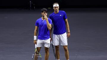 BERLIN, GERMANY - SEPTEMBER 20: Alexander Zverev and Carlos Alcaraz of Team Europe speak against Taylor Fritz and Ben Shelton of Team World during the Men's Doubles match on day one of Laver Cup at Uber Arena on September 20, 2024 in Berlin, Germany. (Photo by Clive Brunskill/Getty Images for Laver Cup)