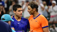 Mar 19, 2022; Indian Wells, CA, USA;  Rafael Nadal (ESP) gripping shakes hands Carlos Alcaraz (ESP) after their semifinal match at the BNP Paribas Open at the Indian Wells Tennis Garden. Mandatory Credit: Jayne Kamin-Oncea-USA TODAY Sports