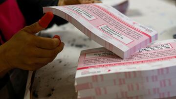 An employee of the National Electoral Institute (INE) arranges ballots at a warehouse with voting materials for the recall referendum on President Andres Manuel Lopez Obrador, which will be held on April 10, in Ciudad Juarez, Mexico March 22, 2022. REUTERS/Jose Luis Gonzalez