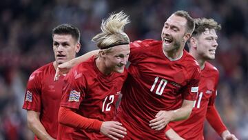 Denmark's forward Kasper Dolberg (L) celebrates scoring the opening goal with his teammate Denmark's midfielder Christian Eriksen during the UEFA Nations League football match between Denmark and France in Copenhagen on September 25, 2022. (Photo by Liselotte Sabroe / Ritzau Scanpix / AFP) / Denmark OUT