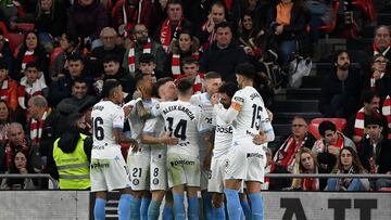 Girona's Ukrainian forward #08 Viktor Tsygankov celebrates with teammates after scoring his team's first goal during the Spanish league football match between Athletic Club Bilbao and Girona FC at the San Mames stadium in Bilbao on February 19, 2024. (Photo by ANDER GILLENEA / AFP)