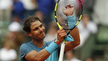 Spain's Rafael Nadal acknowledges cheering spectators after winning his second round match of the French Open tennis tournament against Argentina's Facundo Bagnis at the Roland Garros stadium in Paris, France, Thursday, May 26, 2016. (AP Photo/Alastair Grant)