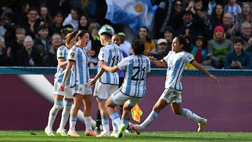 Argentina's midfielder #07 Romina Nunez (2nd L) celebrates with her teammates after scoring her team's second goal during the Australia and New Zealand 2023 Women's World Cup Group G football match between Argentina and South Africa at Dunedin Stadium in Dunedin on July 28, 2023. (Photo by Sanka Vidanagama / AFP)