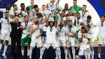 FILED - 28 May 2022, France, Paris: Real Madrid's Marcelo lifts the trophy as his teammates celebrate after winning the UEFA Champions League final soccer match between Liverpool FC and Real Madrid CF at the Stade de France. Photo: Nick Potts/PA Wire